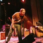 Derek handing me his broken string