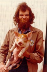 This is the photo the AJC used that so many have likened to the Geico caveman. I was working on a hog farm and the shot was taken at the end of a blustery day.